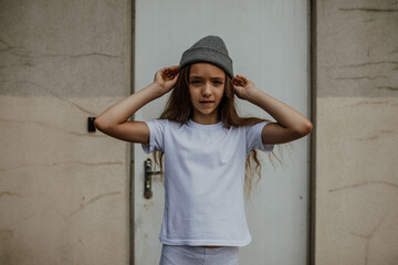 Girl kid wearing white blank t-shirt. Mock up for print.