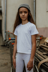 Girl kid wearing white blank t-shirt. Mock up for print.