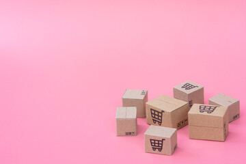 Shopping concept : Cartons or Paper boxes on pink background. online shopping consumers can shop from home and delivery service. with copy space.