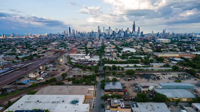 4k aerial drone hyper lapse of the Chicago downtown urban area district at sunset.  the beautiful dramatic skyline shows the amazing building architecture that the city has.