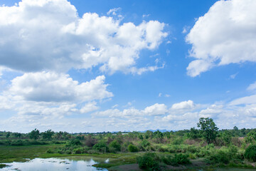 Cirrus and cumulus clouds on blue sky background.