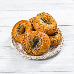 Freshly Baked Bagels Topped with Sesame Seeds, Poppyseeds, Garlic and Onion. Selective focus.
