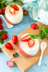 Panna Cotta with jelly strawberries, Italian dessert, home cooking.