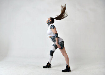 beautiful girl in robes looks and plays with her hair