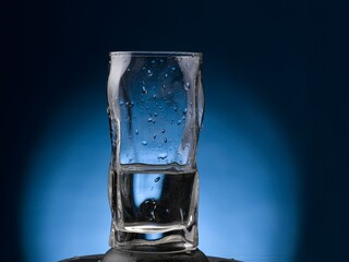 glass of water on blue background