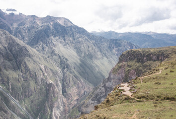 Panoramic view of Colca Canyon with beautiful rocky mountains and Cruz del Condor viewpoint near...