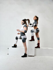 beautiful girls in robes look at each other and touch their hair