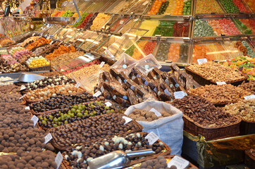 Sweet and chocolate stall in the food market in Barcelona, Spain, Mercado de La Boqueria.