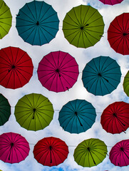 Many multi-colored umbrellas on a background of sky in Guangzhou, Gangdong Province, China