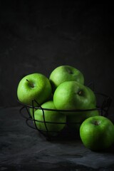 green apples on a black background