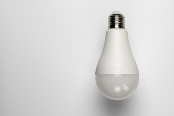 An electric light bulb on a white background with copy space.