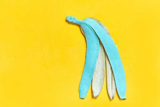 colored peel banana in cyan color. copy space