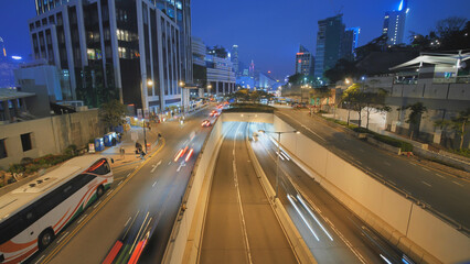 Fototapeta na wymiar Time lapse of night city car traffic in the evening in Hong Kong.