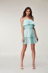 Woman beautiful face natural make up brunette hair tanned skin body wear fashion summer collection...