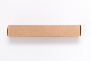 Oblong cardboard box on white background. Mock-up image. Flat lay, top view