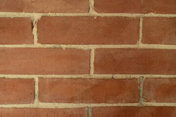 The texture of the red bricks laying on the stove