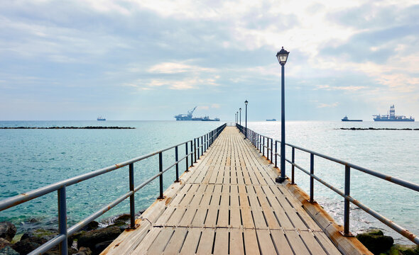 Fototapeta Walking pier by the sea in Limassol