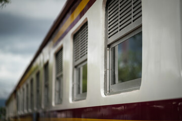 Window row pattern of local train (passenger cabin bogie). Transportation vehicle's part object photo. Travel and journey concept.