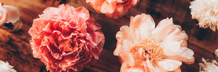 Abundance of Peonies Bouquet, Fresh bunch of flowers on rustic background. Card Concept, shoot from above, flat lay, banner size