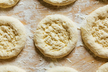 Cooking at home, getting the bread ready to be baked.