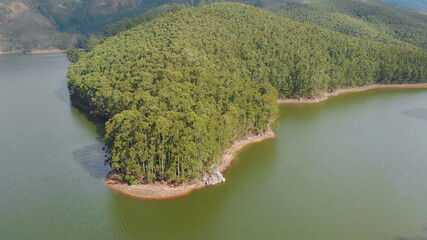 Aerial view beautiful nature with mountains and hills by Lake Mattupetty. Kerala State. Near the city of Munar.