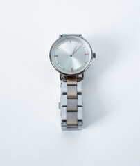 The female wrist watch isolated on a white background. Elegant mechanical wristwatch made of silver...
