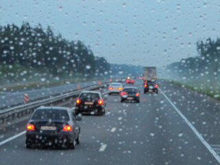 Highway traffic at rainy dusk