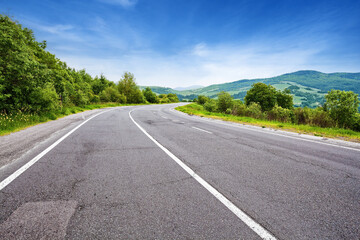 Empty mountain road in summer day