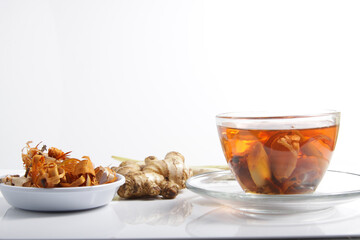 Picture of traditional herbal drink that contains ginger, clove, limegrass, cinnamons and secang (Caesalpinia sappan L) for immunity improvement