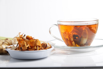 Picture of traditional herbal drink that contains ginger, clove, limegrass, cinnamons and secang (Caesalpinia sappan L) for immunity improvement