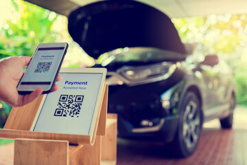 Selective focus to tablet with blurry smart phone and car service.