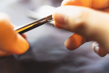 Employees are changing the phone SIM card, nano SIM card in the shop for customers to buy, Man's hand.