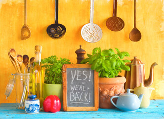 Restaurant announcing reopening after the corona lockdown,cooking, gastronomy business concept with utensils, food ingredients, blackboard with message