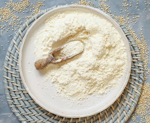 Raw white quinoa floour and seeds top view