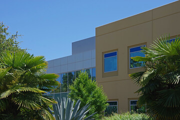Corporate Buildings in a lush landscape environment under a bright blue sky