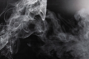 White steam on a black background.