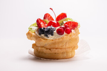 Home made cake with cream and fruits isolated.