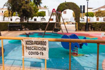 Signs that prohibit the use of a playground during de-escalation due to coronavirus. Posters:...