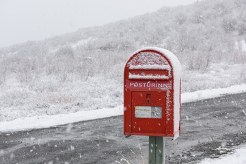 red mailbox in snow