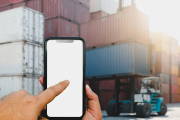 Forklift truck lifting cargo container in shipping yard or dock yard against sunrise sky for transportation import,export and logistic industrial concept.