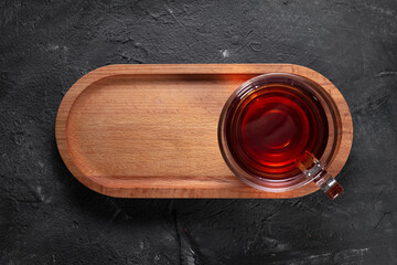 Wooden presentation and snack on stone floor