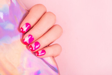 Obraz na płótnie Canvas Trendy and bright manicure design in pink