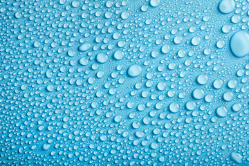 Water drops pattern on blue background