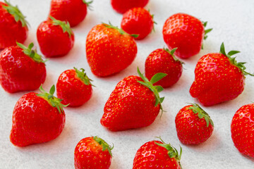 A lot of strawberries on a white background.