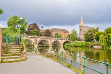 Fototapeta na wymiar Shrewsbury town river scene with bridge and church
