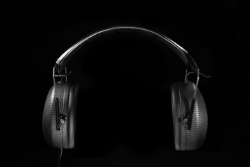 Black headphones in dark environment