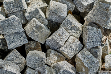 Stone square cubes in gray color close up