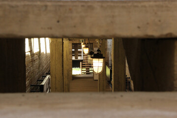Hanging bulkhead lamp under the concrete ceiling.