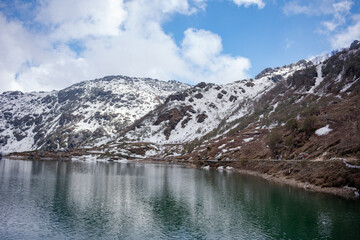 Fototapeta na wymiar Tsogmo lake and snow covered hills.