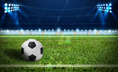Fototapeta na wymiar Soccer ball on green football field, space for text